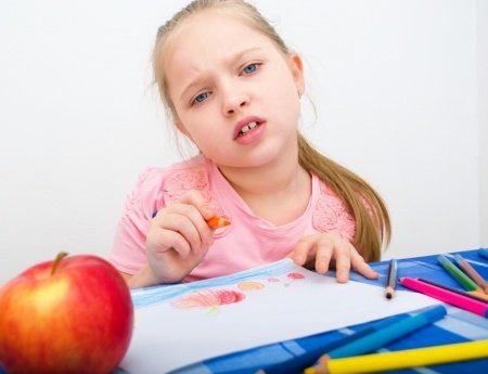 Child coloring a picture